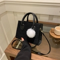 Retro black corduroy crossbody bag with white plush ball charm in a cozy home setting - Black With Pendant