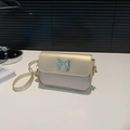 Retro crossbodytas met strik in champagnegoud en zilver met glitterafwerking - Goud