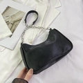 Fashionable black faux leather hobo bag with a silver chain and leather shoulder strap - Black
