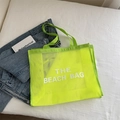 Neon green mesh beach tote bag with The Beach Bag print and long top handles - Yellow With White Lettering