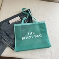 Mint green mesh beach tote bag with large white text print and nylon straps - Lake Blue With White Text