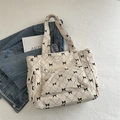 Bolso tote de pana blanco crema con acolchado de lazos negros y bolsillo frontal - Blanco Roto