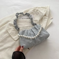 Pale blue pleated cloud bag featuring white pearl handle and ruched shoulder strap - Silver
