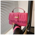 Detail of pink quilted crossbody bag with gold chain strap and metallic buckle closure - Rose Pink