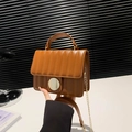 Brown striped quilted handbag with round handle and gold chain strap for women - Brown