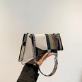 Modern geometric patchwork shoulder bag with silver chain strap and asymmetrical design - Brown