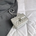 Chic silver quilted chain bag with metallic finish and rectangular twist lock closure - Silver