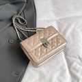 Champagne apricot quilted crossbody bag with silver rotating lock and chain strap - Pink