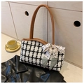 Detail of checkered tweed tote bag with brown leather handles and decorative silk scarf - Brown