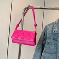 Quilted crossbody bag in vibrant fuchsia pink with minimalist rope strap details - Rose Red