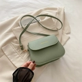Light green faux leather crossbody bag with gold lettering and adjustable strap - Green