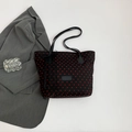 Black tote bag featuring red heart patterns and a delicate black lace bow accessory - Black (Red Heart Pattern)