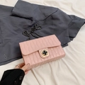 Pink quilted crossbody bag with chain strap and clover clasp for summer fashion - Pink
