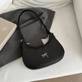 Chic black crescent hobo bag with silver metallic bow detail and adjustable shoulder strap - Black