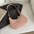 Pink crescent moon underarm bag with an elegant metal bow detail and shoulder strap - Pink
