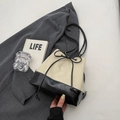 Minimalist drawstring bucket bag in ivory woven fabric and black leather contrast - Rice White (No Pendant)
