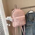 Pink mini backpack with marble texture and cloud plush charm hanging on a metal rack - With Pendant / Pink