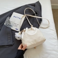Off-white drawstring bucket bag with colorful sequins and white pompom charm - Beige with Pendant