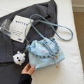 Light blue bucket bag with colorful wavy embroidery and a white plush cat charm - Blue with Pendant