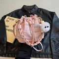 Pink drawstring bucket bag with colorful rainbow wave embroidery and a plush pendant - Pink With Pendant