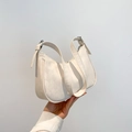 Minimalist beige moon-shaped underarm bag with diamond quilted texture and wide strap - White