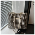 Detail of houndstooth fabric texture and metal chain strap on this stylish tote bag - Off White