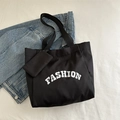 Schwarze Canvas-Tragetasche mit weißem FASHION-Aufdruck und kleiner Innentasche - Schwarz