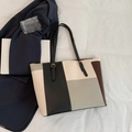 Color-block leather tote bag in black, white, and grey with thin shoulder straps - Gray