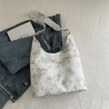 Hobo tote bag with butterfly and star prints on white leather and gold hardware - Green