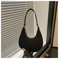 Detail of black crescent shoulder bag with crocodile pattern texture and gold hardware - Black
