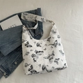 White butterfly print underarm bag with matching wide shoulder strap and artistic props - Black