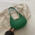 Chic green crocodile embossed crescent hobo bag with gold hardware on neutral background - Green
