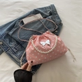 Pink drawstring bucket bag with white polka dots, pearl handle and metal butterfly ornament - Pink