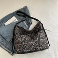 Leopard print tote bag with black bow and dual metal zippers on white background - Tan