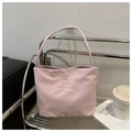 Detail of light purple fabric handbag featuring stylish pretty and liberty embroidery - Pink