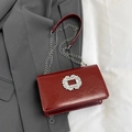 Red patent leather crossbody bag with sparkling crystal buckle and silver chain strap - Red