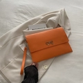 Elegant orange envelope clutch bag with silver metal bow and wristlet strap - Orange