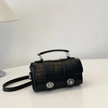 Fashionable black embossed crossbody bag with double silver locks and a top handle - Black