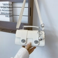 White eel-textured small square handbag with dual silver locks and top handle - Beige with Pendant