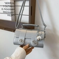 Silver metallic crossbody bag with dual turn-locks and decorative sphere pendant - Silver With Pendant