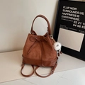Brown suede drawstring bucket backpack with plush charm and versatile shoulder straps - Coffee with Pendant
