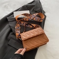 Brown quilted crossbody bag with triangle pattern and wide blue orange strap - Brown