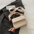 Chic cream quilted handbag with a wide artistic pattern strap in a stylish crossbody design - Khaki