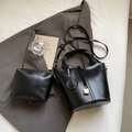 Black glossy bucket bag set with mini pouch, gold locket charm, and slim shoulder strap - Shoulder Bag Set / Black