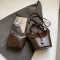 Dark brown retro bucket bag set with textured synthetic leather and smile pendant - Shoulder Bag Set / Coffee