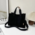 Black corduroy tote bag with dual front pockets and adjustable shoulder strap - Black