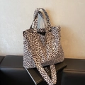 Detail of leopard print tote bag with dual handles and wide shoulder strap - Off White