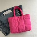 Pink quilted puffer tote bag with a minimalist design and soft aesthetic style - Rose Pink