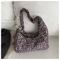 Detailed view of leopard print hobo bag featuring a stylish ruched scrunchie shoulder strap - Black