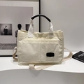 Cream corduroy tote bag with dual front pockets and adjustable crossbody strap - No Pendant / Black